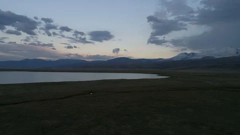 Sunset view of a mountain lake and valley Stock Footage 108028983