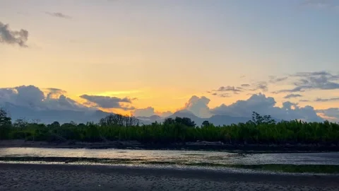 Sunset, view of the mountains from the sea at low tide, the bottom of the sea is Stock-Footage 241581926