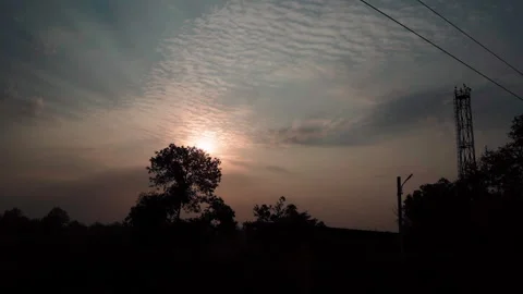 Sunset View from Moving Train Window with Railway Electric Lines and Dramatic Stock Footage 337544142