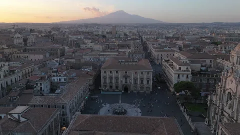 Sunset view of Mt. Etna flying over main piazza of Catania Sicily Stock Footage 280178377