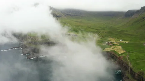 Sunset view of Mulafossur Waterfall and Gasadalur village. Vagar, Faroe Islands. Video stock 167846801