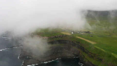 Sunset view of Mulafossur Waterfall and Gasadalur village. Vagar, Faroe Islands. Video stock 167848031