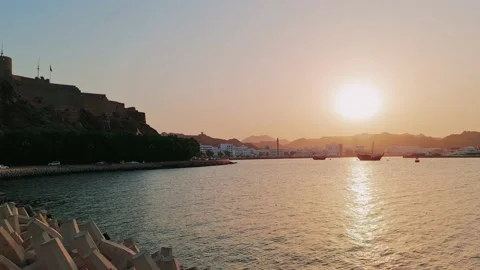Sunset view in Muscat corniche with sea and mountain in background Stock Footage 159370537