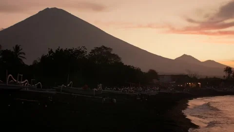 Sunset view on ocean and mountains from beach Stock Footage 158827227