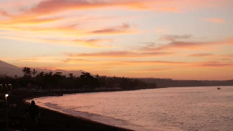 Sunset view on ocean and mountains from beach Stock Footage 159639715