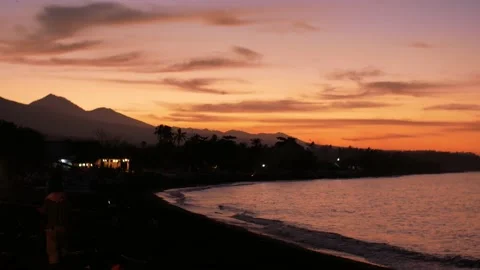 Sunset view on ocean and mountains from beach Video stock 161782492