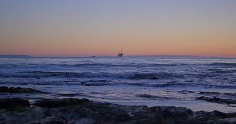 Sunset View of Oil Rig off Beach of California Coast Video stock 232339175