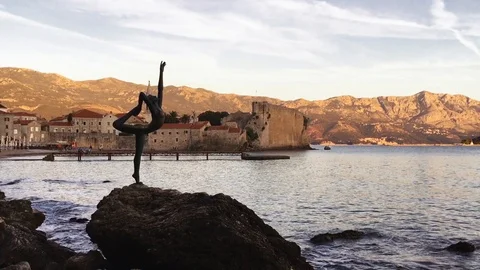Sunset view of Old District of Budva and Statue of Ballerina, Montenegro Stock Footage 120826260