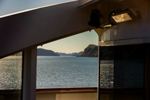 Sunset view out of a ship window Stock Photos