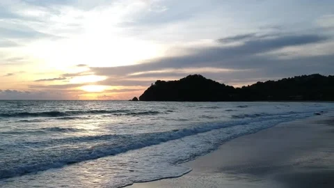 Sunset view over a beach waves in Thailand Stock Footage 136877481