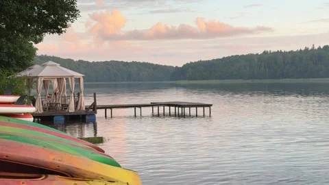 Sunset view over calm lake with pier Stock Footage 317811355