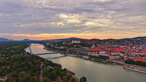 Sunset view over the Danube River with buildings and hills in the background Stock Footage 341379598