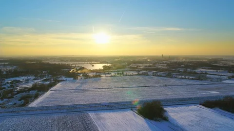 Sunset view over the fields covered with snow Stock Footage 102834998