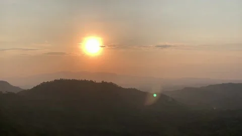Sunset view over the mountains in the evening Stockbeeldmateriaal 231836812