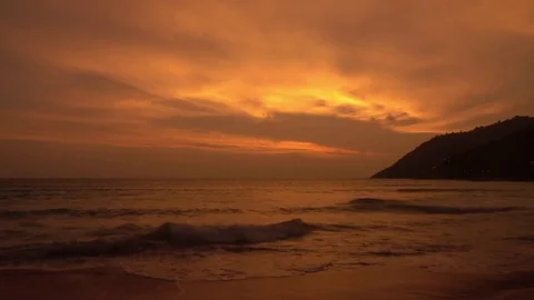 Sunset view over tropical beach and sea in gold colors. Seascape view in 4k 動画素材 72110590
