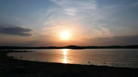 Sunset view over water at a beach in Norway in 2022 with calm skies and dis.. Stock Footage 340213655
