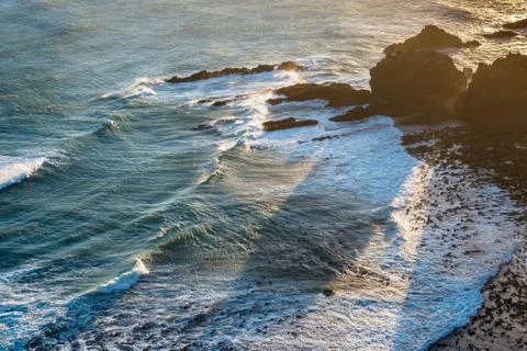 Sunset view of the Pacific Ocean waves at Nugget Point Stock Photos