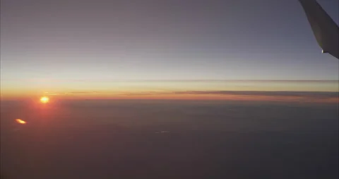 Sunset view from plane C4K 25p Stock Footage 135399001