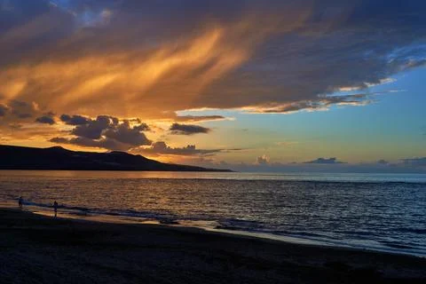 Sunset view at Playa de Las Canteras beach at Las Palmas de Gran Canaria, Spain Stock Photos