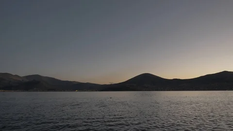 Sunset View of Puno mountains from the Titicaca lake, Peru. Stock Footage 125288784