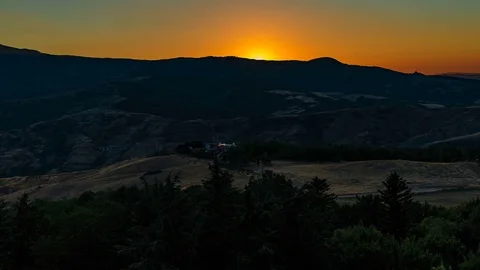 Sunset view from Radicofani castle in Tuscany, time-lapse Stock Footage