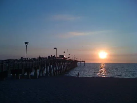 Sunset view on the river beside the bridge 스톡 사진