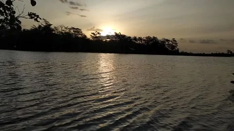 Sunset view on a river. Video stock 186851051