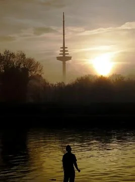 Sunset view by the river with the radio tower in the background Stock Photos
