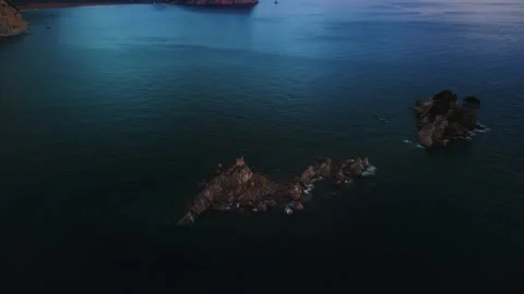 Sunset view of saint stefan island church St. Nedjelja Church on a rocky outcrop Stock Footage 313733266