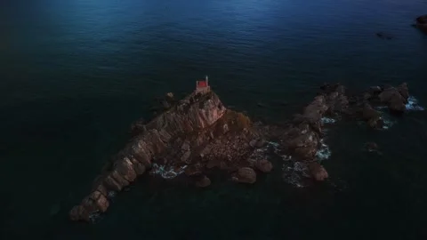 Sunset view of saint stefan island church St. Nedjelja Church on a rocky outcrop Stock Footage 313733285