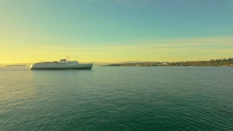 Sunset view of a ship anchored off the coast of Victoria, British Columbia Stock Footage 294951330