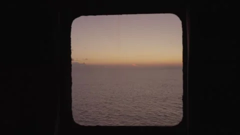 Sunset view from the ship's window zoom out. Sea voyage Stock Footage 293710901