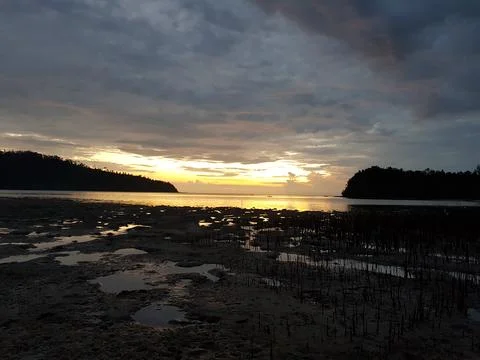 Sunset view at the shore Stock Photos