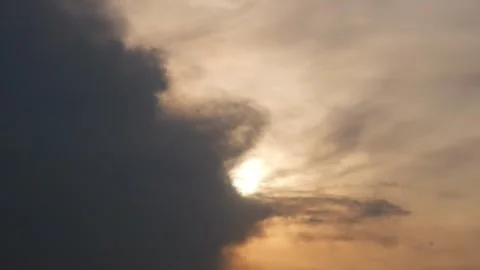 Sunset view with silhouettes of birds flying in a cloudy sky Stock Footage 333419675