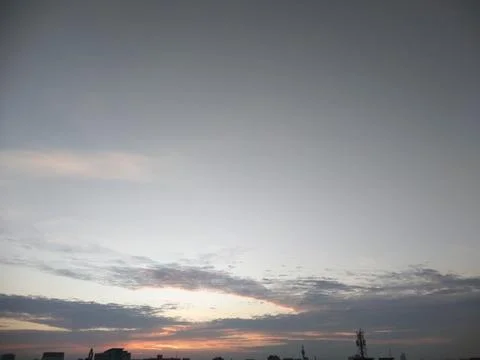 The sunset view in the sky with dark clouds Stock Photos