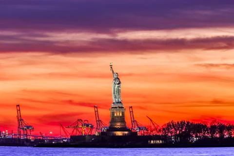 A sunset view of the Statue of Liberty Stock Photos