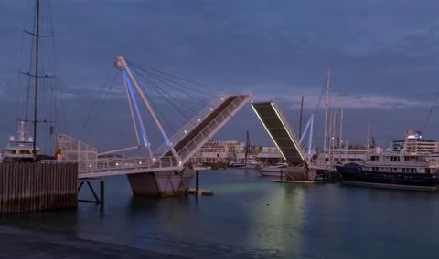 A sunset view of a swing bridge opening Stock Photos