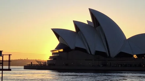 Sunset view of the Sydney Opera House with the harbor in the foreground Stock-Footage 276188670