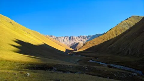Sunset view to Tash-Rabat river and valley in Naryn province, Kyrgyzstan Stock Photos