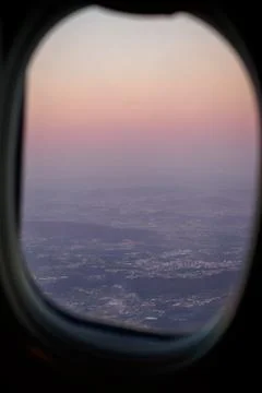 Sunset view through an airplane window in Porto Stock Photos