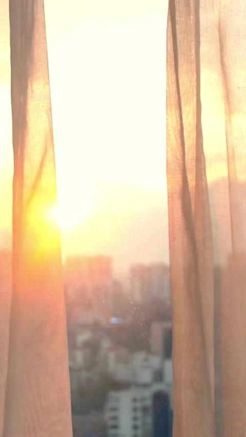 Sunset view through curtains over a big city skyline Stock Footage 331932362