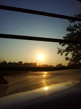 Sunset View Through Window with Bars Stock Photos