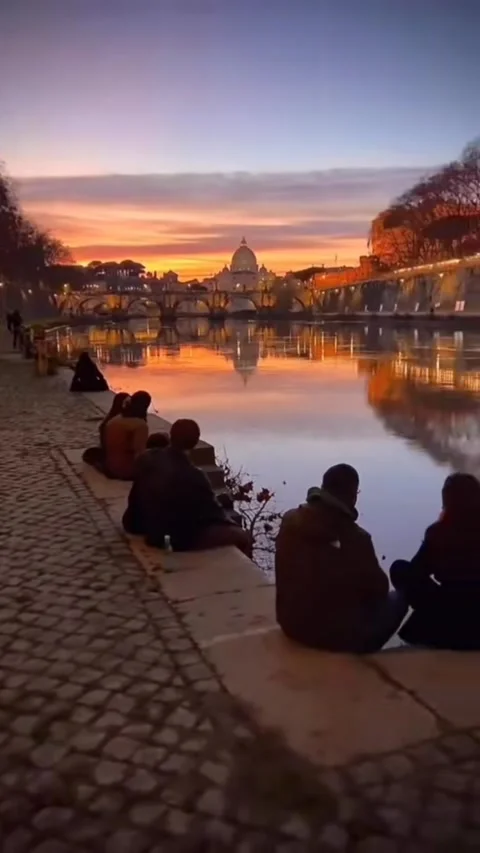 Sunset View of Tiber River in Rome with People Relaxing 4K Vertical Cinematic Stock Footage 329078193