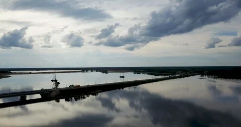 Sunset view from the top of the river with a bridge Stock Footage 98649380