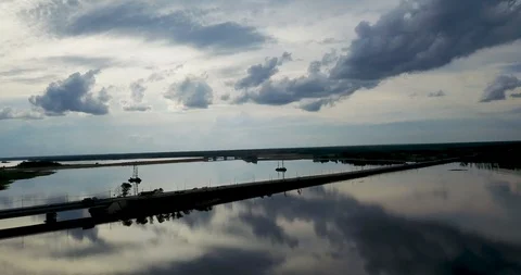Sunset view from the top of the river with a bridge Stock Footage 98649397