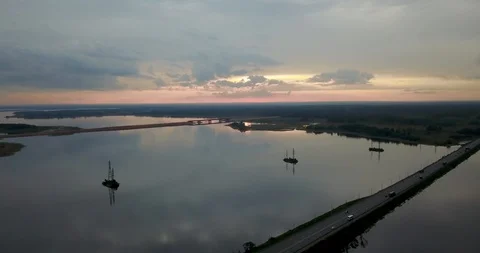 Sunset view from the top of the river with a bridge Stock Footage 98650229
