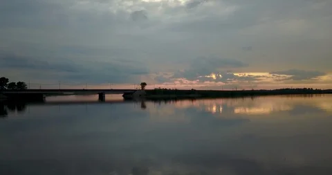 Sunset view from the top of the river with a bridge Stock Footage 98650357