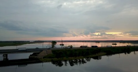 Sunset view from the top of the river with a bridge Stock Footage 98650420