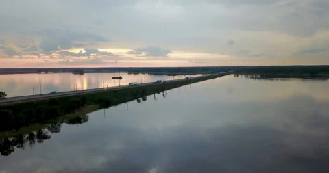 Sunset view from the top of the river with a bridge Stock Footage 98650452