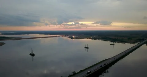 Sunset view from the top of the river with a bridge Stock Footage 98650489